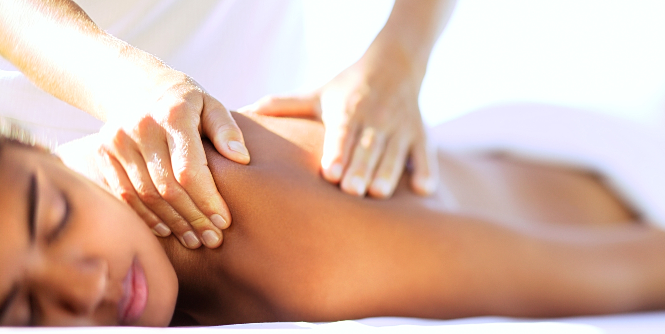 Massage therapist doing body work / image source: babymoonlex.com